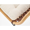 Chaise en rotin avec cousin en tissu beige