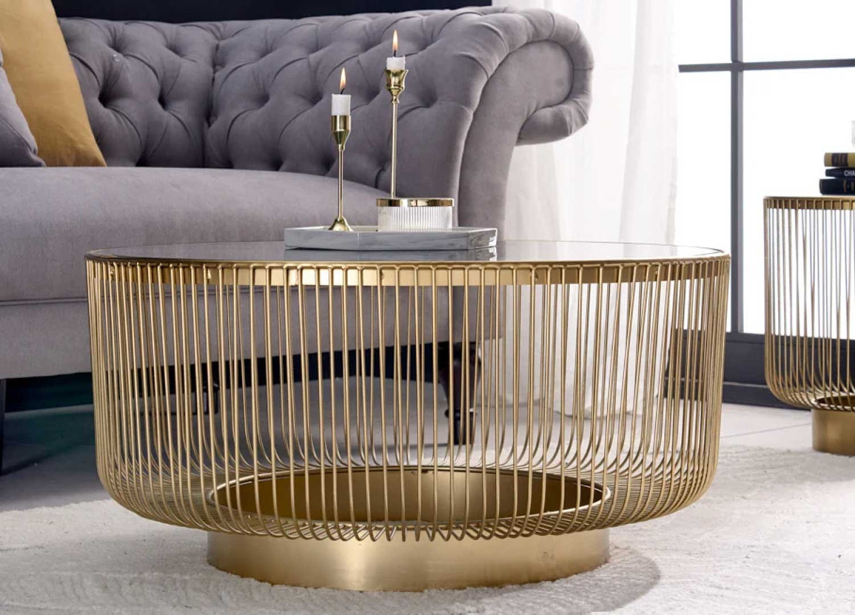 Table basse design ronde dorée et verre noir