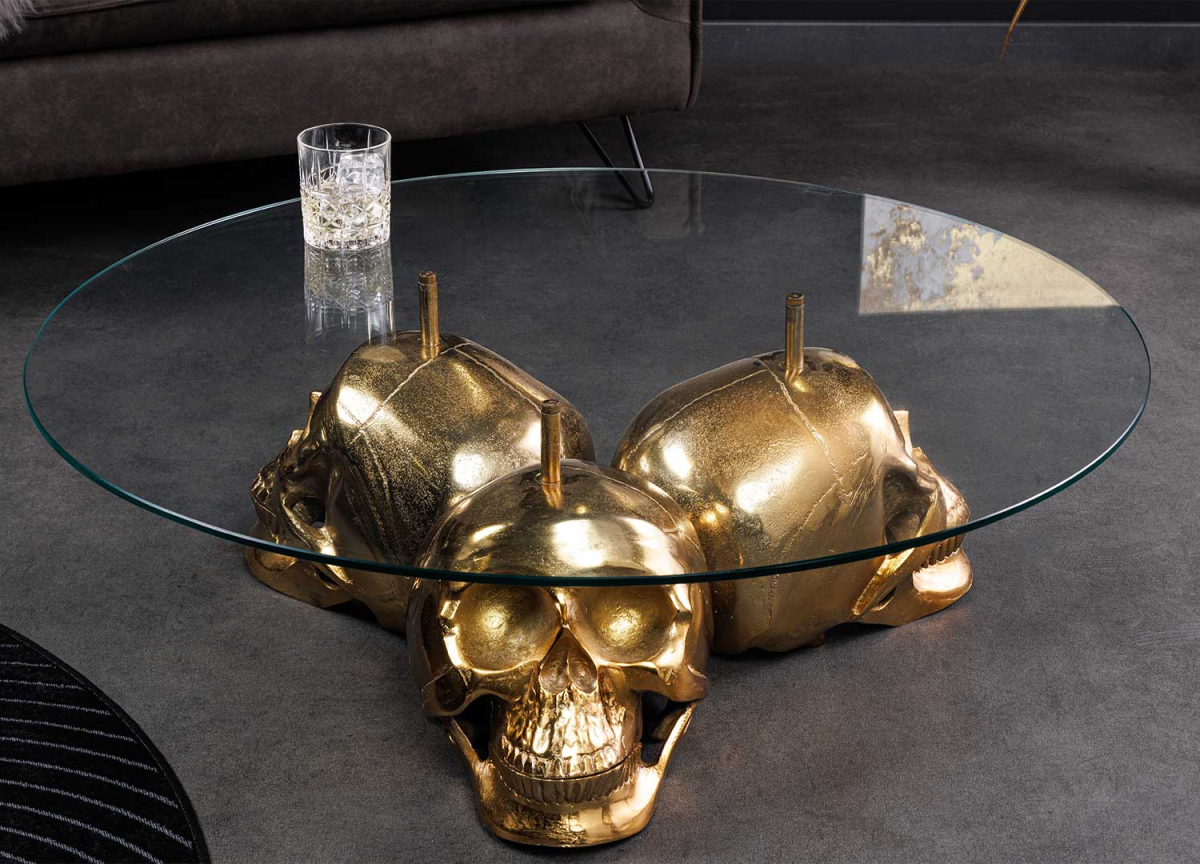 Table basse originale ronde en verre et pieds crânes dorés