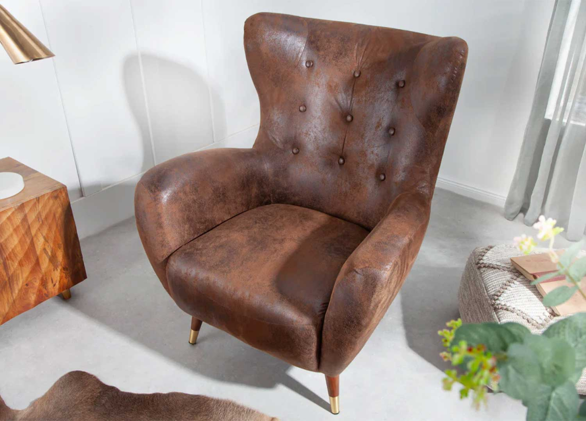 Fauteuil à oreilles en cuir marron vintage