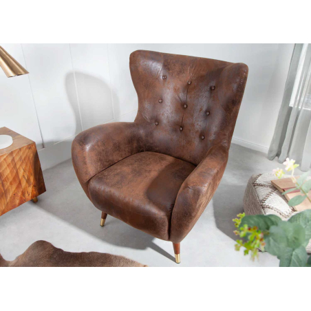 Fauteuil à oreilles en cuir marron vintage