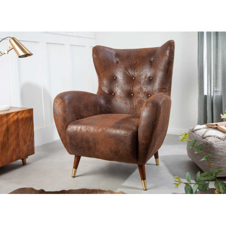 Fauteuil confortable en cuir marron vieilli