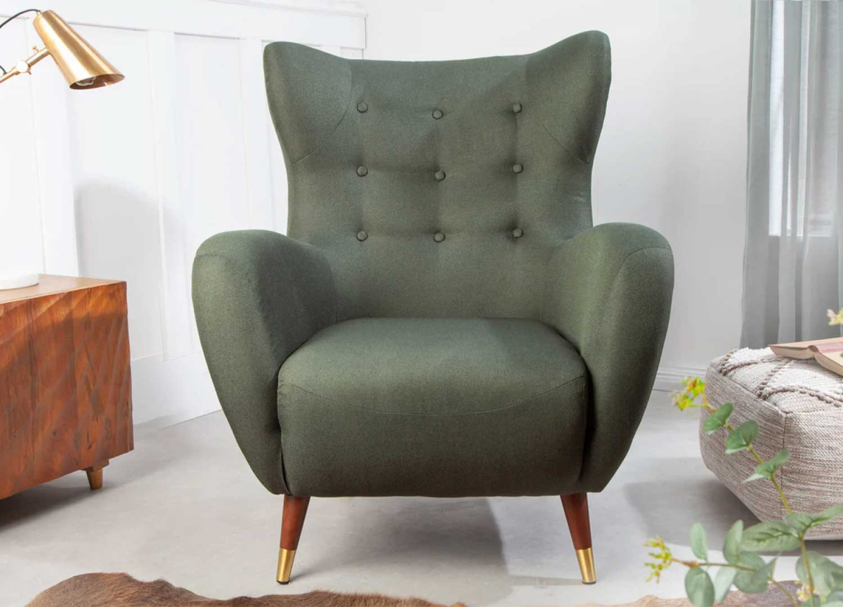 Fauteuil capitonné en tissu vert